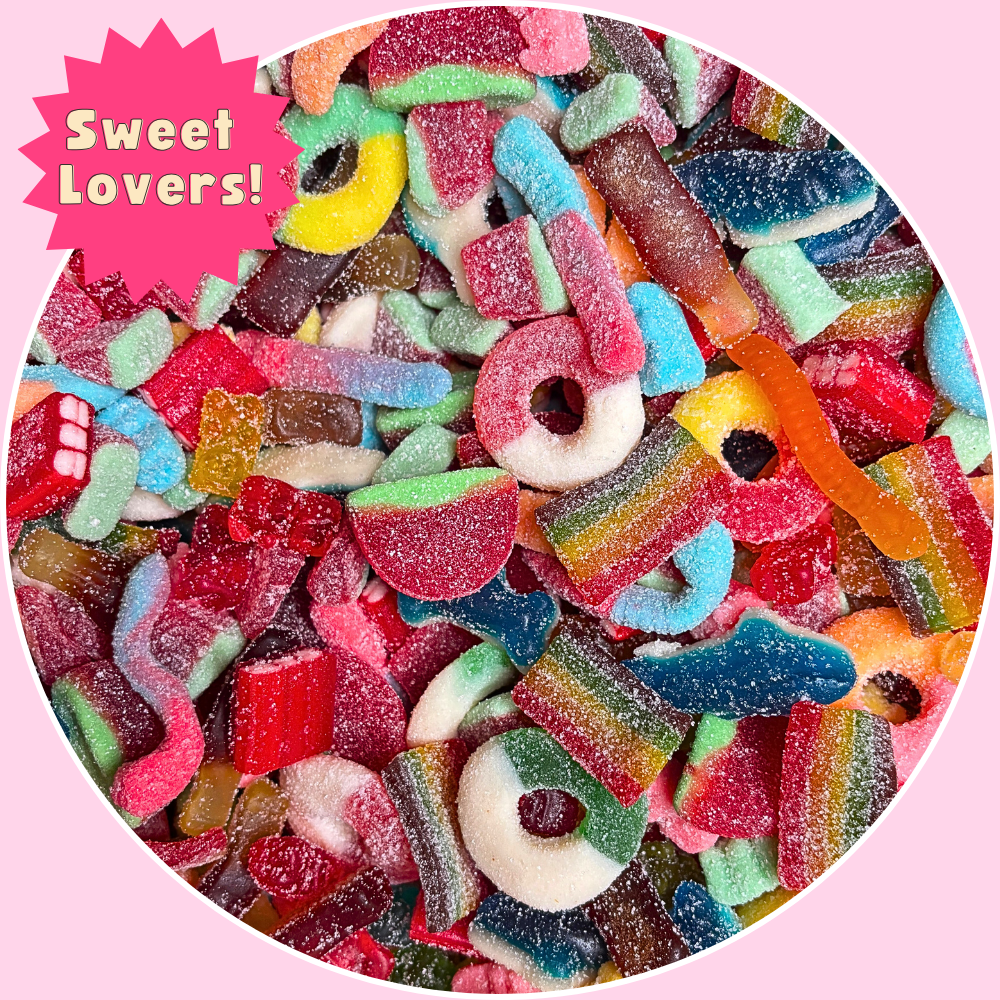 A bright and colorful Sweet Lovers gummy mix featuring classic candy favorites like fruity flavor gummy worms, apple rings, gummy sharks, watermelon rings, cherry hearts, peach rings, and neon gummy bears. Packed in a resealable Bits Candy pouch. This chewy candy assortment is soft, juicy, and sugar-coated. Perfect for snacking, gifting, or satisfying sweet tooth cravings. Available in 1lb, 2lb, and 3lb resealable bags.