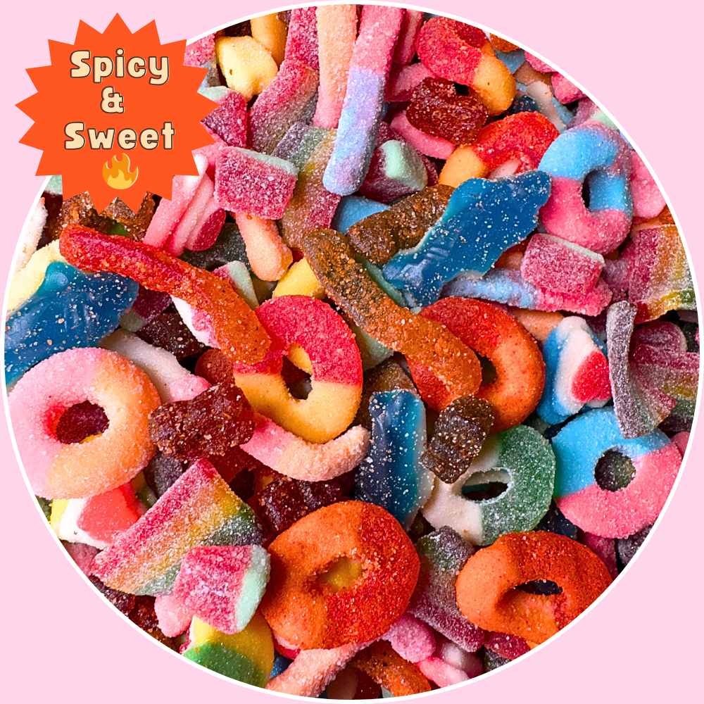 A bold and colorful Sweet & Spicy gummy mix featuring chamoy-coated neon gummy worms, sour apple rings, spicy rainbow belts, chili peach rings, gummy sharks, and tangy gummy bears. Packed in 1lb, 2lb, and 3lb resealable bags. Perfect for sharing, gifting, or satisfying spicy candy cravings. This chewy candy assortment blends sweet, sour, and heat for a fun, flavorful snack. 